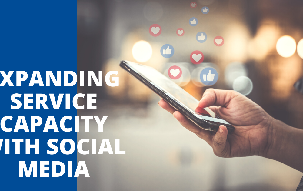Expanding Service Capacity With Social Media blog feature image; hand holding smart phone with like and love emojis floating out above