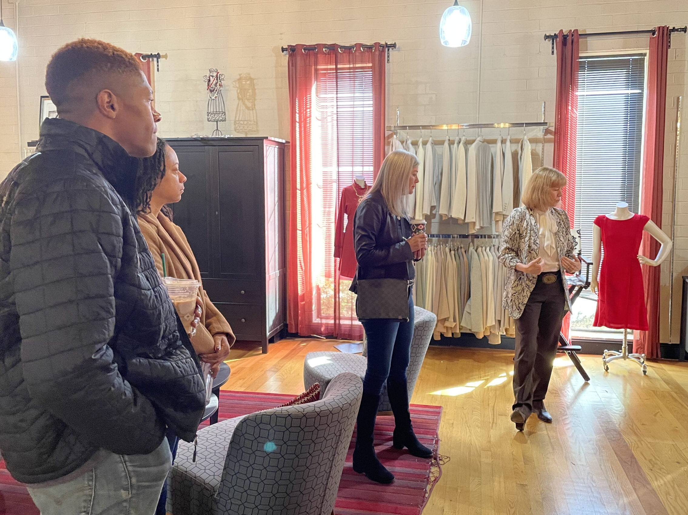 Kerry Barr O'Connor, former Executive Director of Dress for Success, providing a tour of the area where women try on clothing in preparation of the next step of their journey.