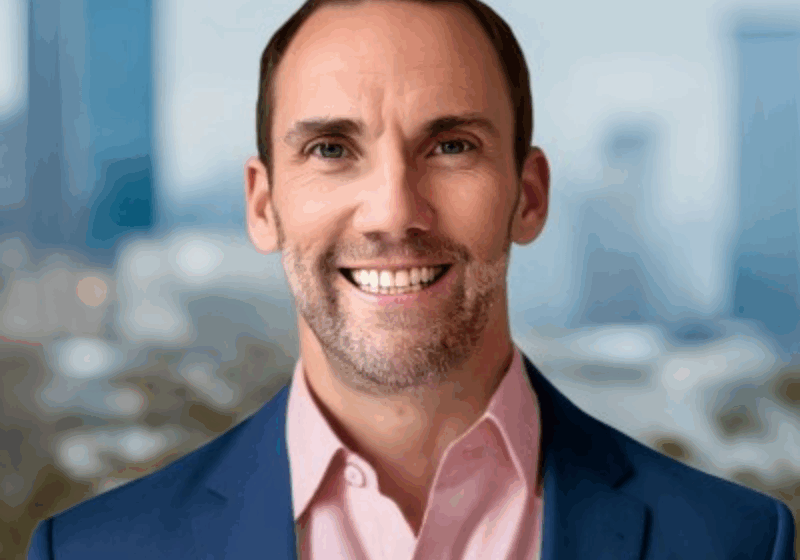 Headshot of Eric Hoffman with Charlotte in background